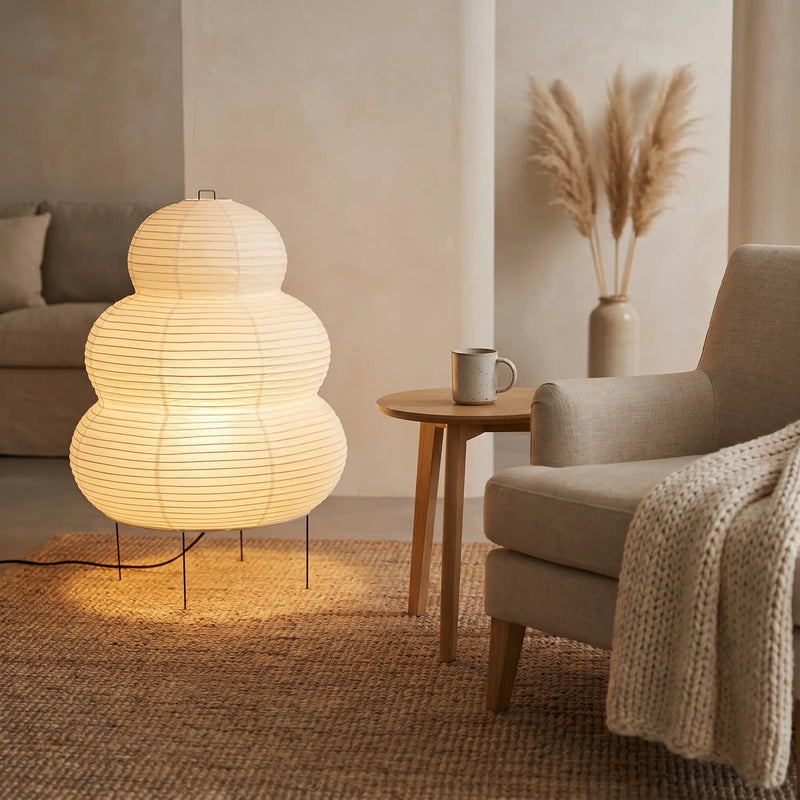 Wabi sabi tiered paper floor lamp in a bright Japandi dining room corner – soft visual focus and warm light