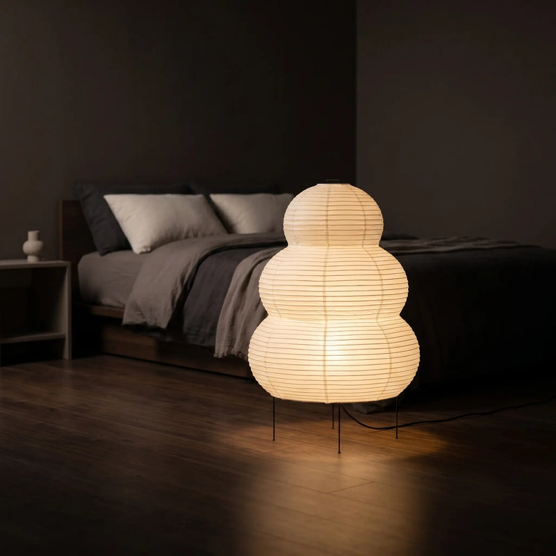 Lummero tiered paper lamp glowing in dark bedroom – peaceful soft night light for calm minimalist space